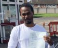 Damion with Driving test pass certificate